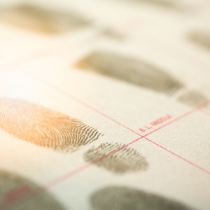 Criminal record document with fingerprints